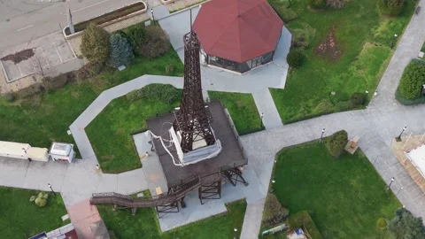 Drone aerial view of Eiffel Tower replica in urban park Stock Footage 322538096