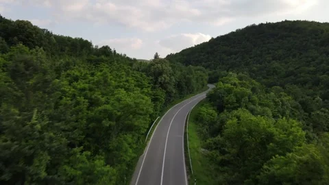 Drone aerial view empty asphalt road in summer day on mountain range Stock Footage 244884327