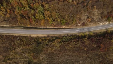 Drone aerial view empty asphalt road in autumn day on mountain range Video stock 254024228