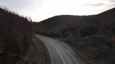 Drone aerial view empty asphalt road in autumn day on mountain range Видео 254519996