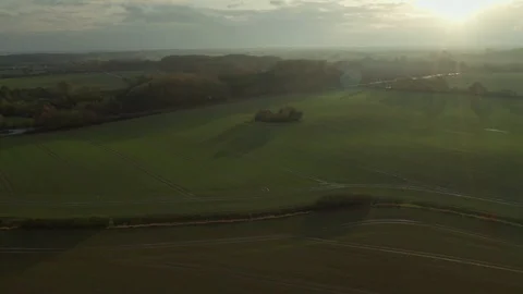 Drone aerial view of fields and road during late afternoon Stock Footage 119465464