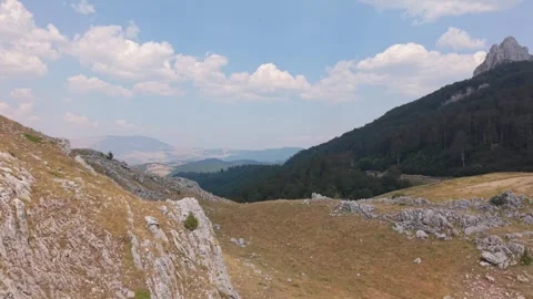 Drone Aerial View Flying Across Rocky Slopes and Mountain Ridge Towards Peak  Stock-Footage 343673958