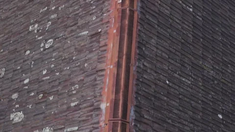 Drone aerial view flying over old tiled roof Stock Footage 341909517