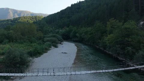 Drone Aerial View Flying Towards Wooden Suspension Footbridge Over Neretva Vídeos de archivo 343673501