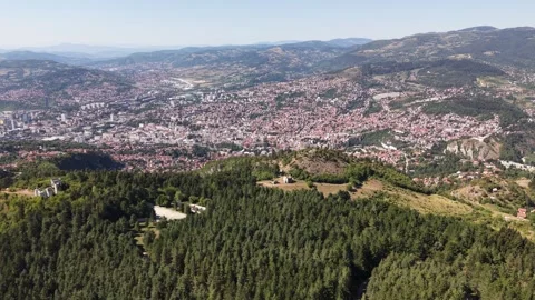 Drone Aerial View Flying From Trebevic Mountain Forest Revealing Panoramic City Stock Footage 343672482