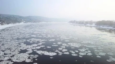 Drone aerial view flying in winter over the river full of floes Stock Footage 102374822
