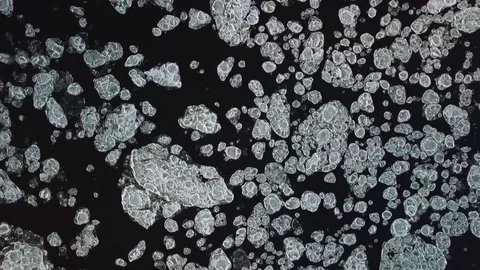 Drone aerial view flying in winter over the river full of floes Stock Footage 102374912