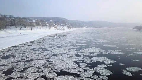 Drone aerial view flying in winter over the river full of floes Stock Footage 102375260