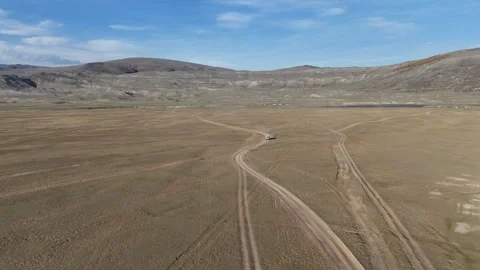 Drone aerial view of fork in dirt tracks near Khoton Nuur Lake Stock Footage 348401166