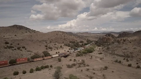 Drone Aerial View of Freight Train Mountain Pass Chasing side angle Stock Footage 92551920
