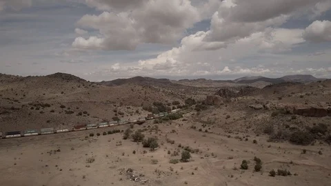 Drone Aerial View of Freight Train in Mountain Pass from the side Stock Footage 92553338