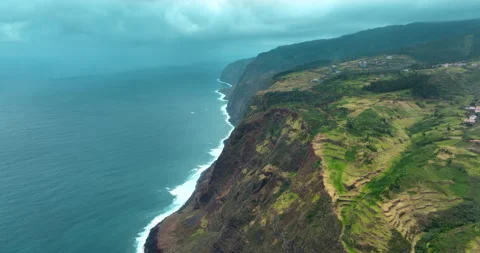 Drone aerial view at High cliff ocean coast of Madeira Island in Portugal Stock Footage 243650854
