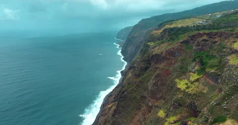 Drone aerial view at High cliff ocean coast of Madeira Island in Portugal Stock Footage 244129226