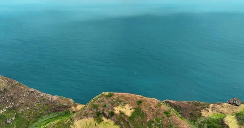 Drone aerial view at High cliff ocean coast of Madeira Island in Portugal Stock Footage 244779749