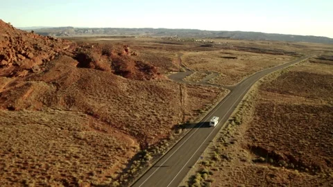 Drone Aerial View of Highway Crossing Dry Desert Landscape Видео 330953053
