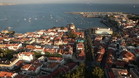 Drone aerial view of historic centre of Cascais, Portugal towards Ribeira beach Stock Footage 203823542