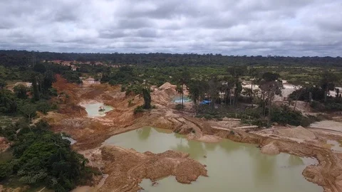 Drone aerial view of illegal gold mining deforestation in the Amazon rainforest. Stock Footage