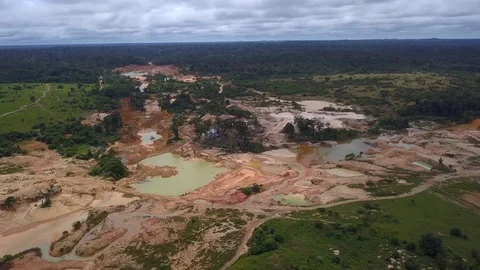 Drone aerial view of illegal gold mining deforestation in the Amazon rainforest. Stock Footage 128778614