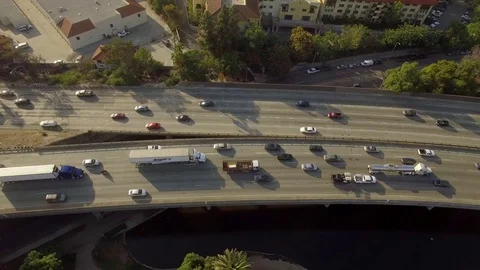 Drone aerial view looking down on highway in traffic Stock Footage 84159691