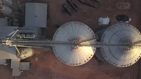 Drone aerial view of metal grain storage silos in an agricultural food industry  Stock Footage 196294656