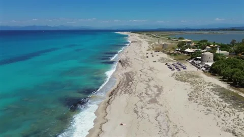 Drone aerial view of Milos beach with historic windmills and turquoise sea in 스톡 동영상 339079655