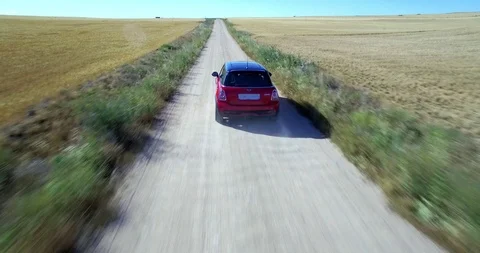 Drone aerial view of Mini Cooper car while driving Stock Footage 106107353