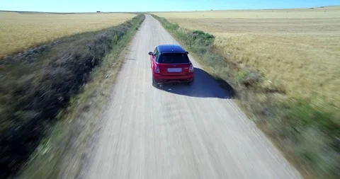 Drone aerial view of Mini Cooper car while driving Stock Footage 106107817