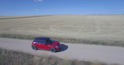 Drone aerial view of Mini Cooper car while driving Stock Footage 106112730