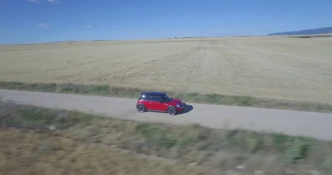 Drone aerial view of Mini Cooper car while driving Stock Footage 106113079
