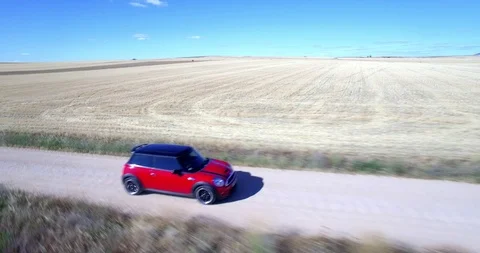 Drone aerial view of Mini Cooper car while driving Stock Footage 106113298