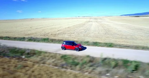 Drone aerial view of Mini Cooper car while driving Stock Footage 106113346