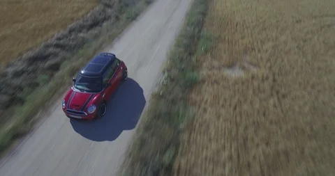 Drone aerial view of Mini Cooper car while driving Stock Footage 106113629