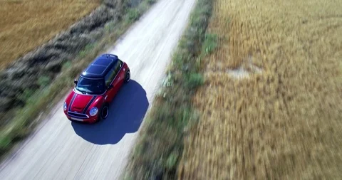 Drone aerial view of Mini Cooper car while driving Stock Footage 106113668