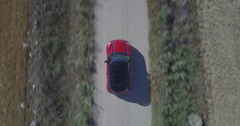 Drone aerial view of Mini Cooper car while driving Stock Footage 106114801