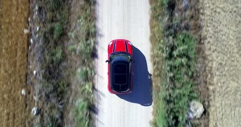 Drone aerial view of Mini Cooper car while driving Stock Footage 106115096