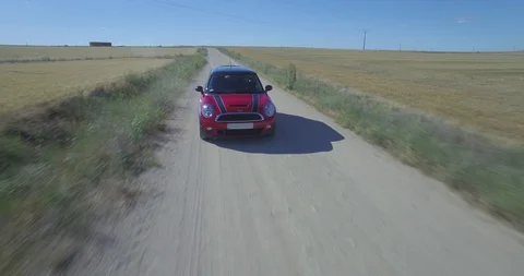Drone aerial view of Mini Cooper car while driving Stock Footage 106116664