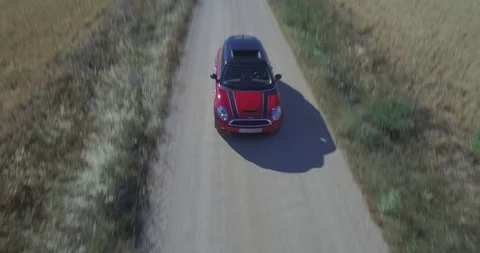 Drone aerial view of Mini Cooper car while driving Stock Footage 106117445