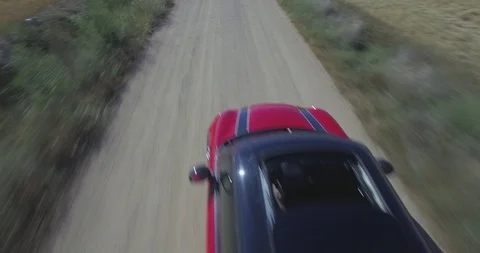 Drone aerial view of Mini Cooper car while driving Stock Footage 106119591