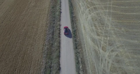 Drone aerial view of Mini Cooper car while driving Stock Footage 106119979
