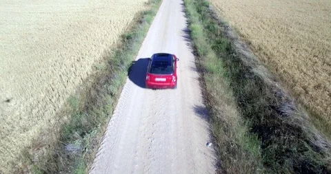 Drone aerial view of Mini Cooper car while driving Stock Footage 106120772