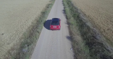 Drone aerial view of Mini Cooper car while driving Stock Footage 106120929