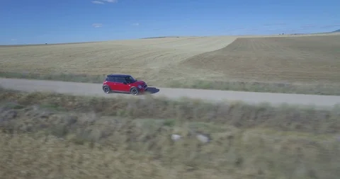 Drone aerial view of Mini Cooper car while driving Stock Footage 106178684
