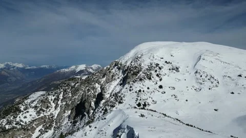 Drone Aerial View of Monte Altissimo – Snowy Alpine Landscape, Rocky Ridges and Vidéo 331223506