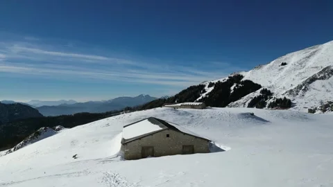 Drone Aerial View of Monte Altissimo – Snowy Alpine Landscape, Rocky Ridges and Vidéo 331223598