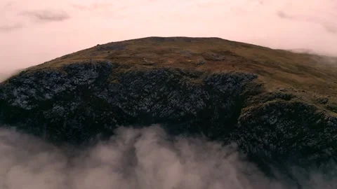 Drone aerial view of a mountain summit during a cloud inversion in Wales Stock Footage 319672202