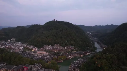 Drone aerial view of the night scene of an ancient city in Xiangxi, Hunan, .. Stockbeeldmateriaal 336156309