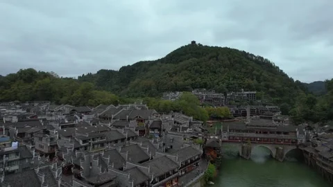 Drone aerial view of the night scene of an ancient city in Xiangxi, Hunan, .. Vídeo Stock 336156332