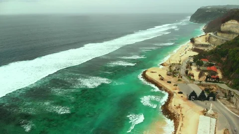Drone aerial view of ocean, beach, cliff, green water, holiday, tourist, in Bali Stock Footage 113046077