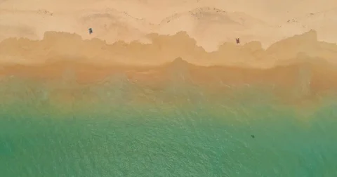 Drone aerial view of ocean waves reaching shore. Aerial view of the tropical 動画素材 75650892