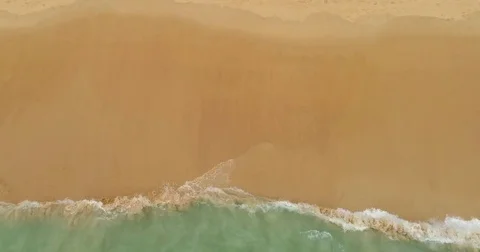 Drone aerial view of ocean waves reaching shore. Aerial view of the tropical Video stock 75651389